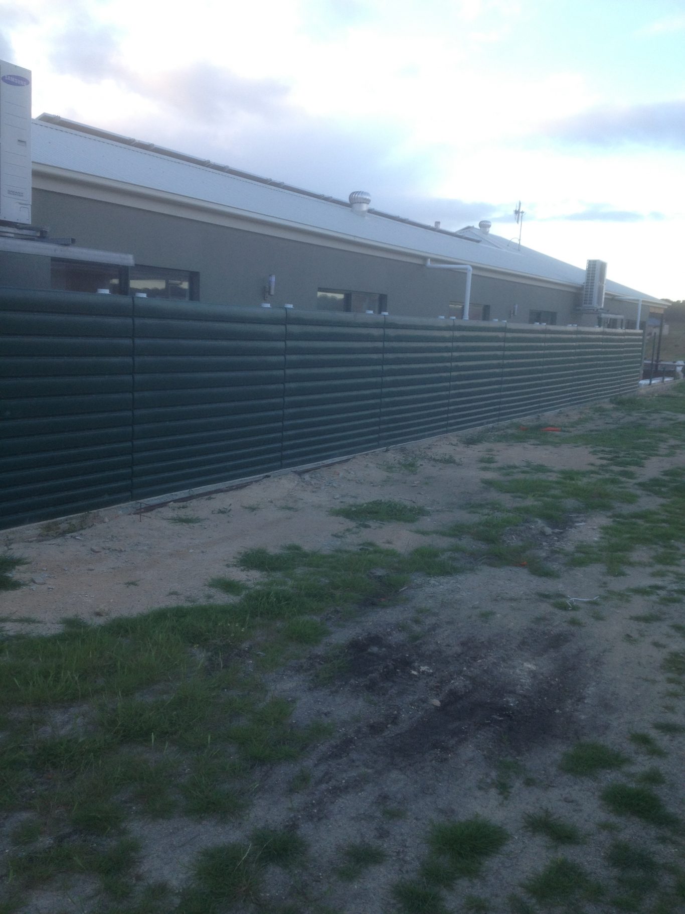 Fence made of 1000L Thin Tanks Thin Tanks Slimline Rainwater Tanks